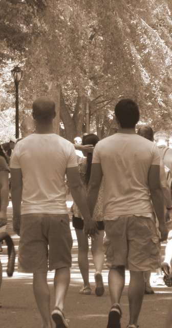 People walking seen from behind, sepia