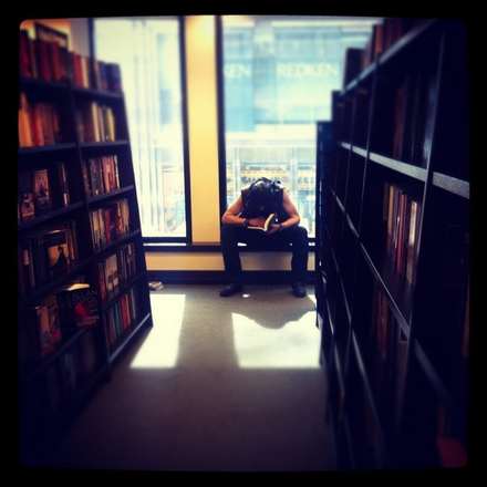 Interior of a bookshop with tall shelves and natural light