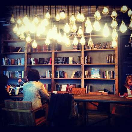 Bookshop café lit by warm lamps