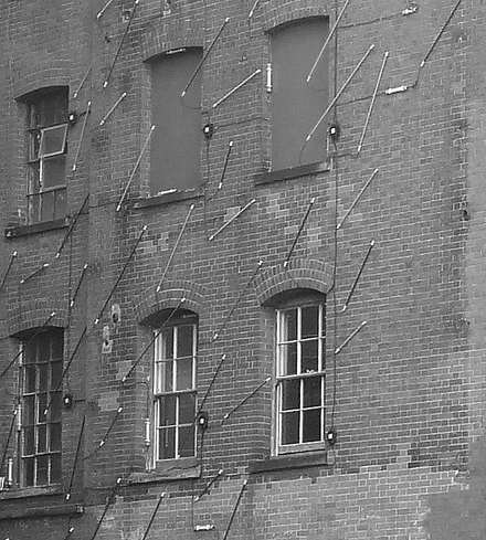 Building façade with rows of windows, black and white