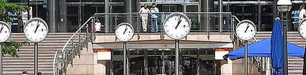 A row of clocks in a large railway station