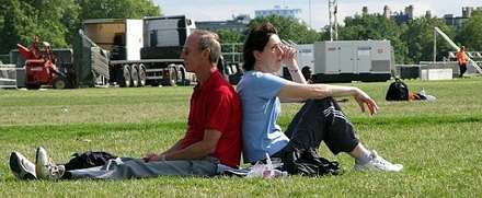 Group of people sitting on the grass in a park